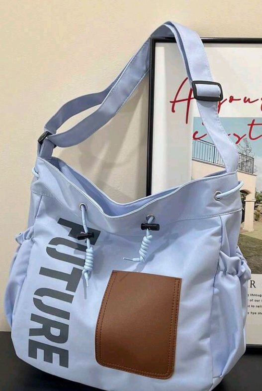 Original camera shot of a light blue Future tote bag